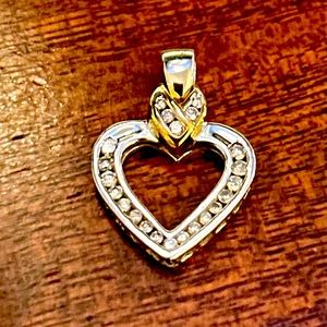 10 karat white/yellow gold heart, diamond pendant .70 carats.